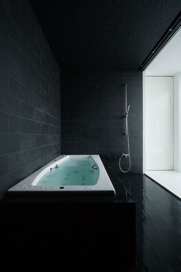 black and white bathroom is from a home in Shiga, Japan, designed by FORM - Kouichi Kimura Architects