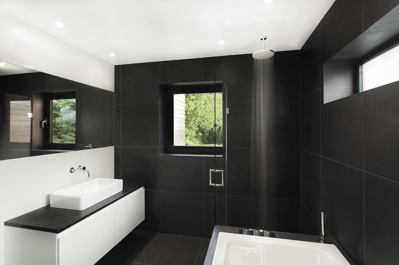 black and white bathroom is in a home in Hampshire, England, designed by AR Design Studio