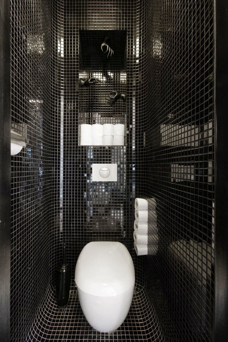 black and white bathroom is in an apartment in Warsaw, Poland, designed by Widawscy Studio Architektury