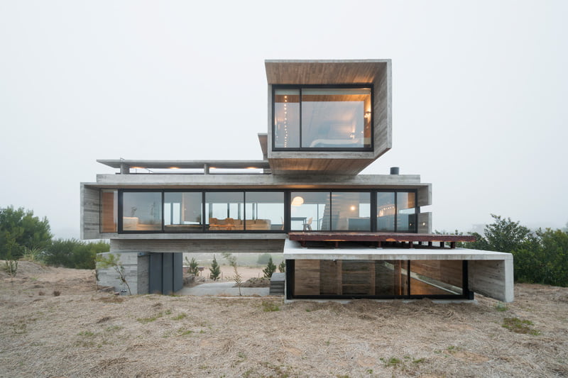 exposed concrete modern house with golfcourse view front elevation