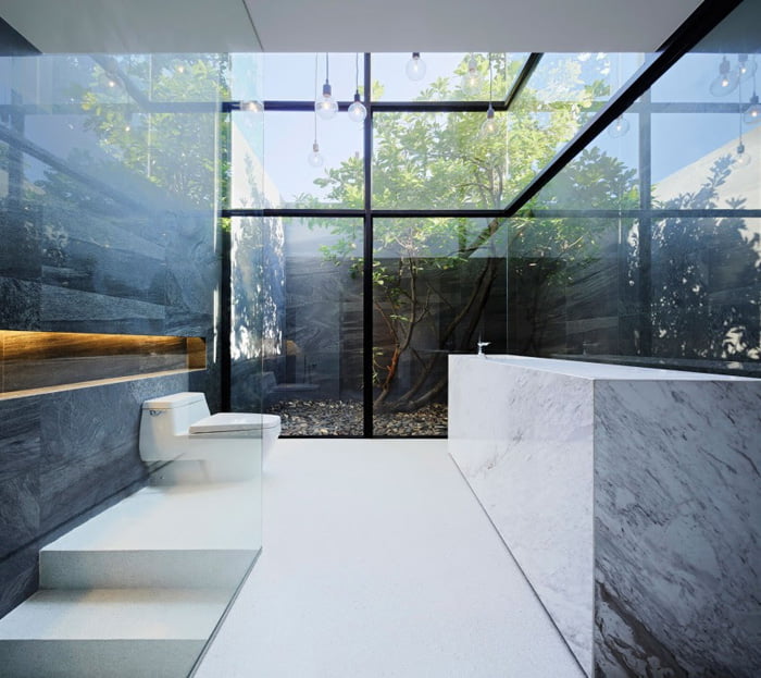 Modern bathroom facing towards internal coutyard as a main design element of house design