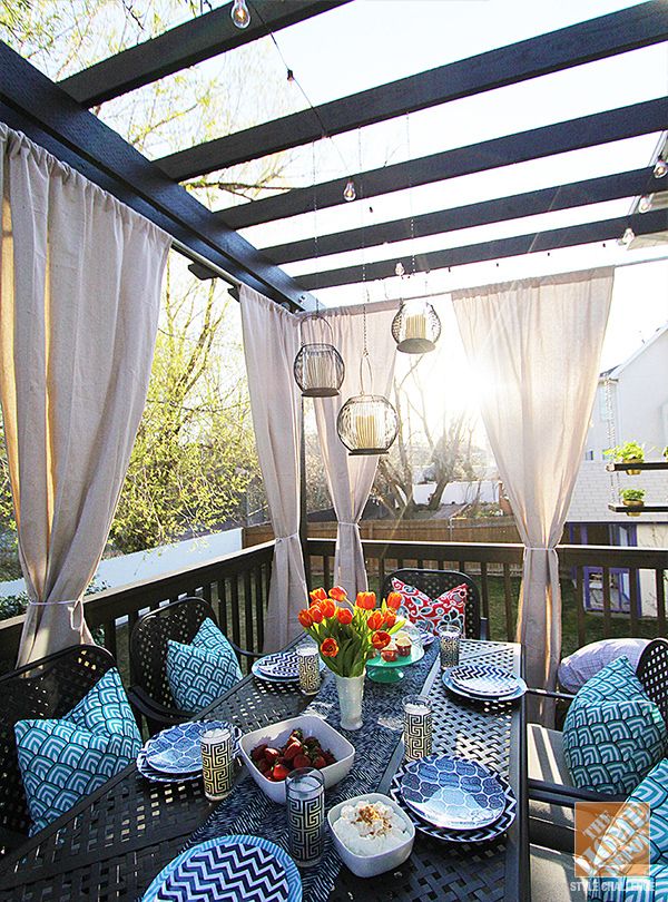 image of wooden pergola with curtain clad