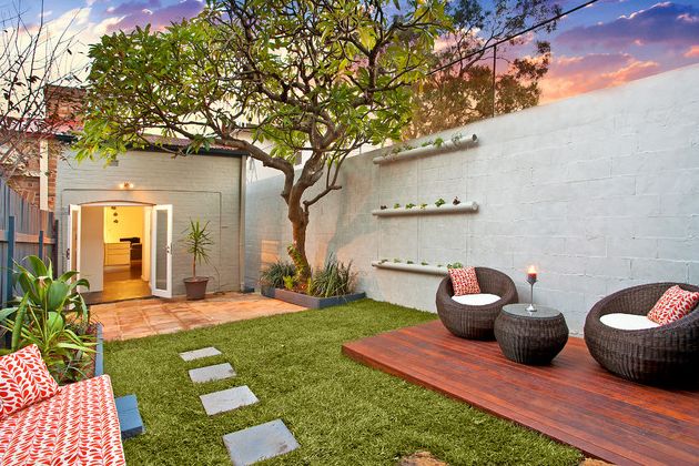 Combine outdoor deck materials with green lawn and concrete pavers