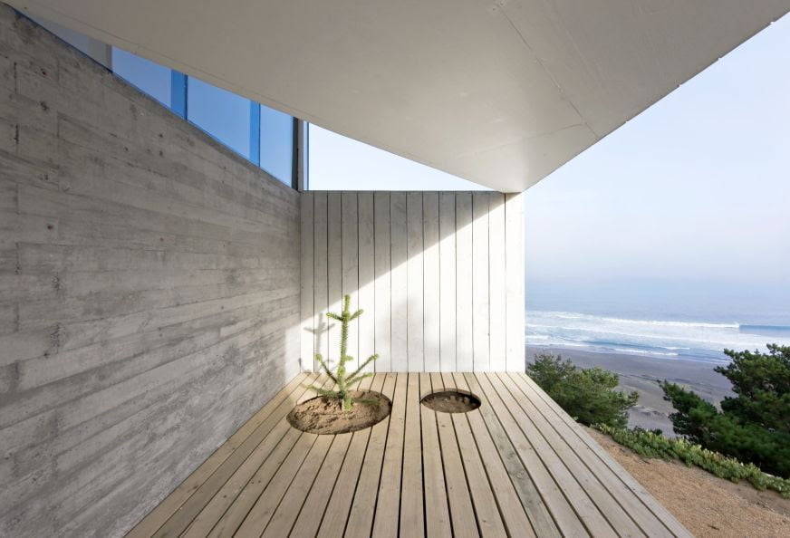 architectural design of deck in cube home with sea side view