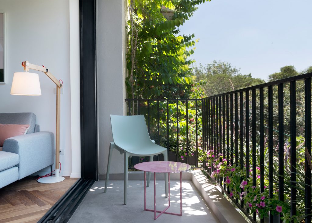 Small Balcony seating and railing design idea in apartment decor.